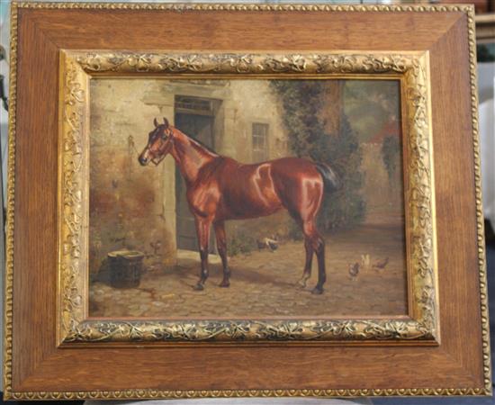 L.H. 1887 Portrait of a chestnut hunter outside a stable, 14 x 18in.